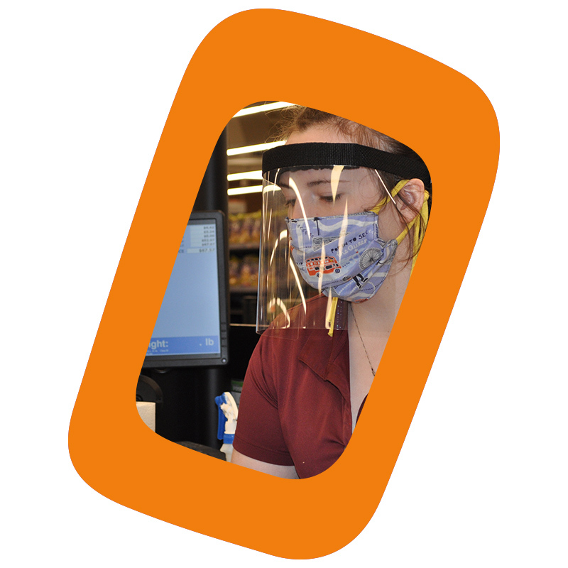 Cashier with a face shield